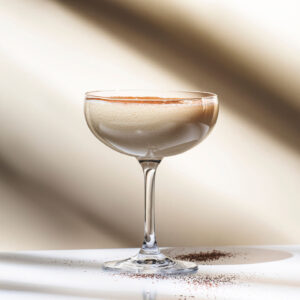 Glass with a bourbon cream cocktail