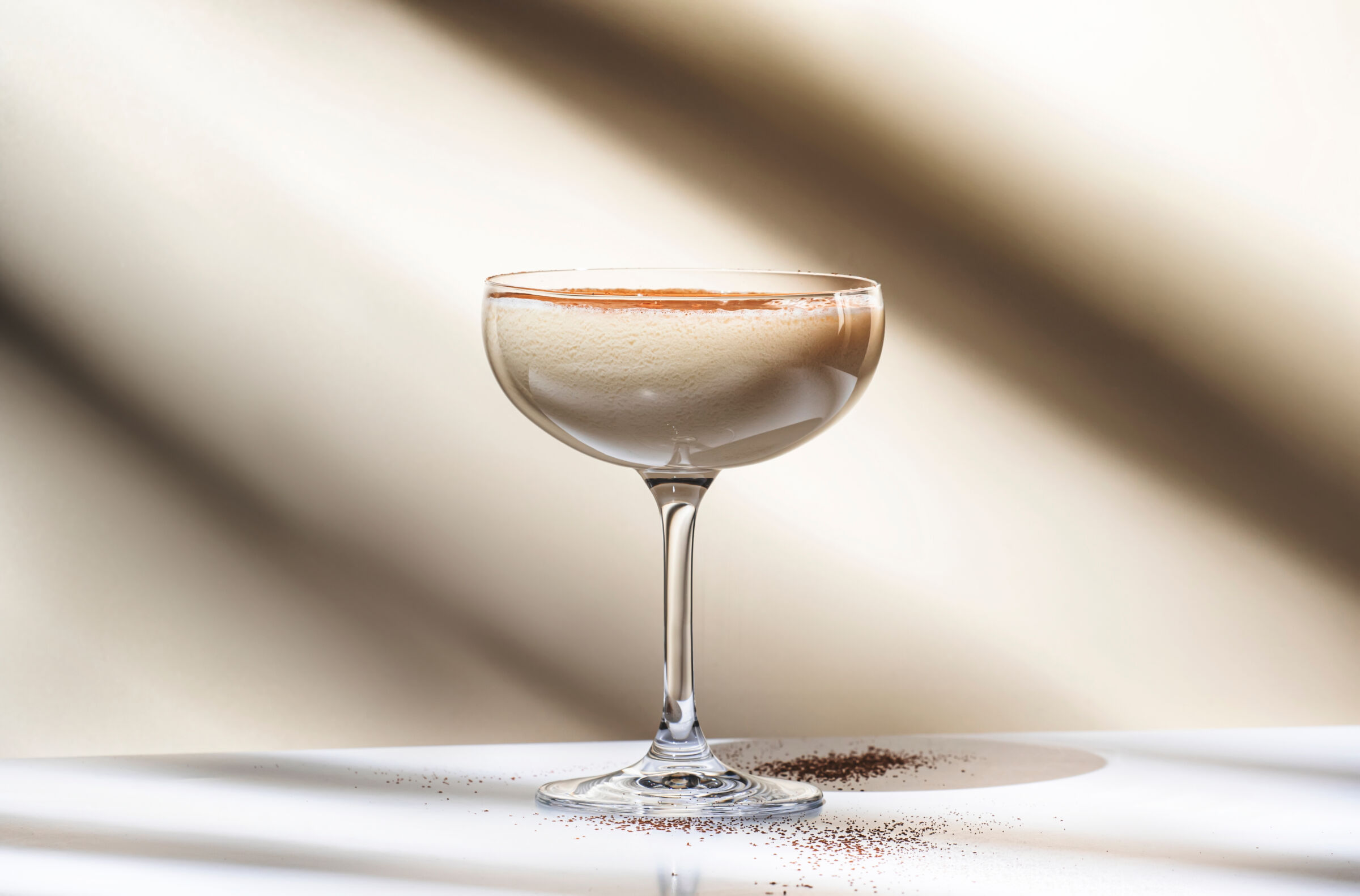 Glass with a bourbon cream cocktail