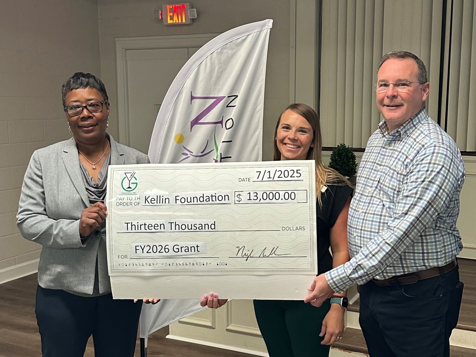 Kellin Foundation accepting a grant check from Greensboro ABC for $13,000.