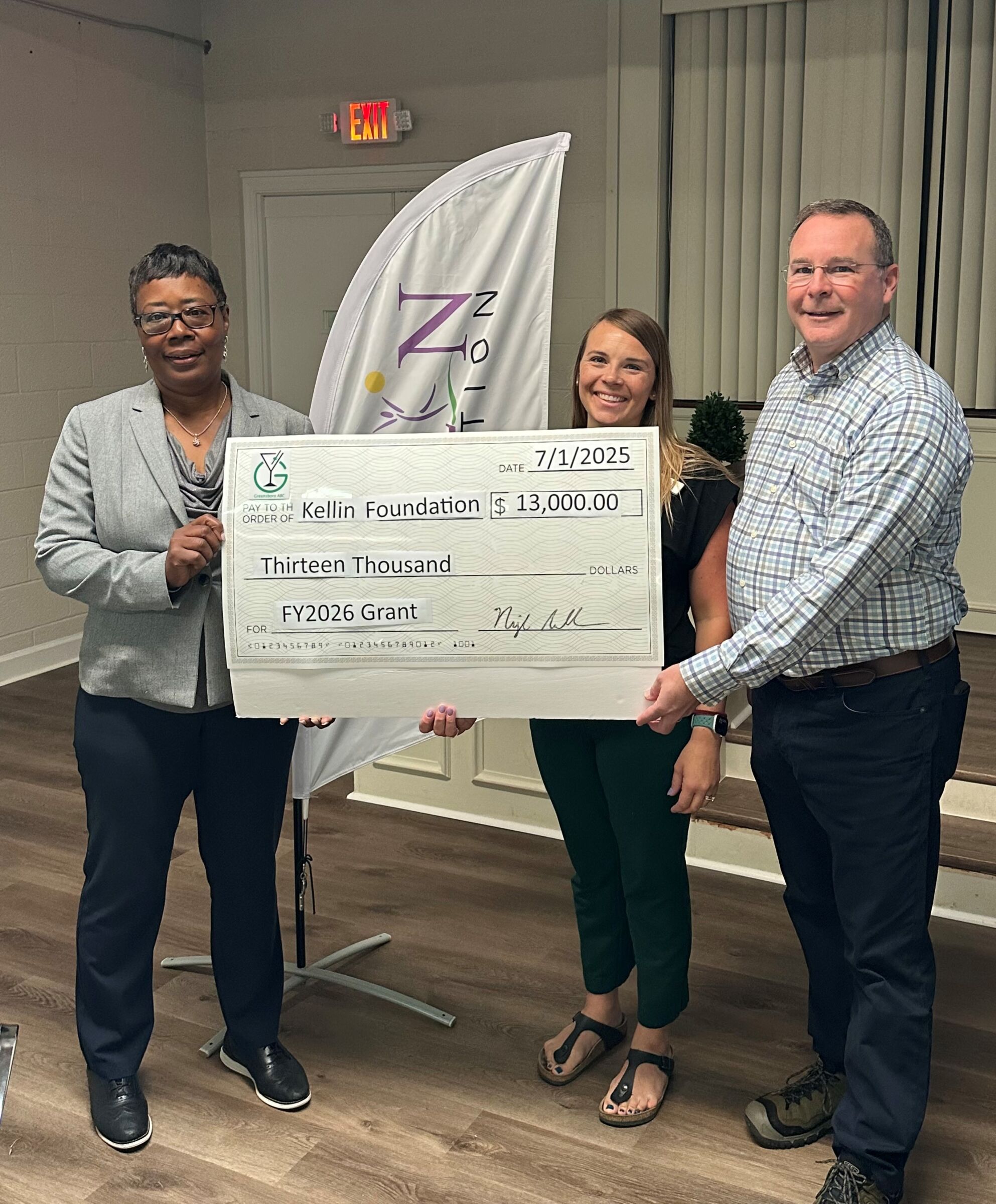 Kellin Foundation accepting a grant check from Greensboro ABC for $13,000.