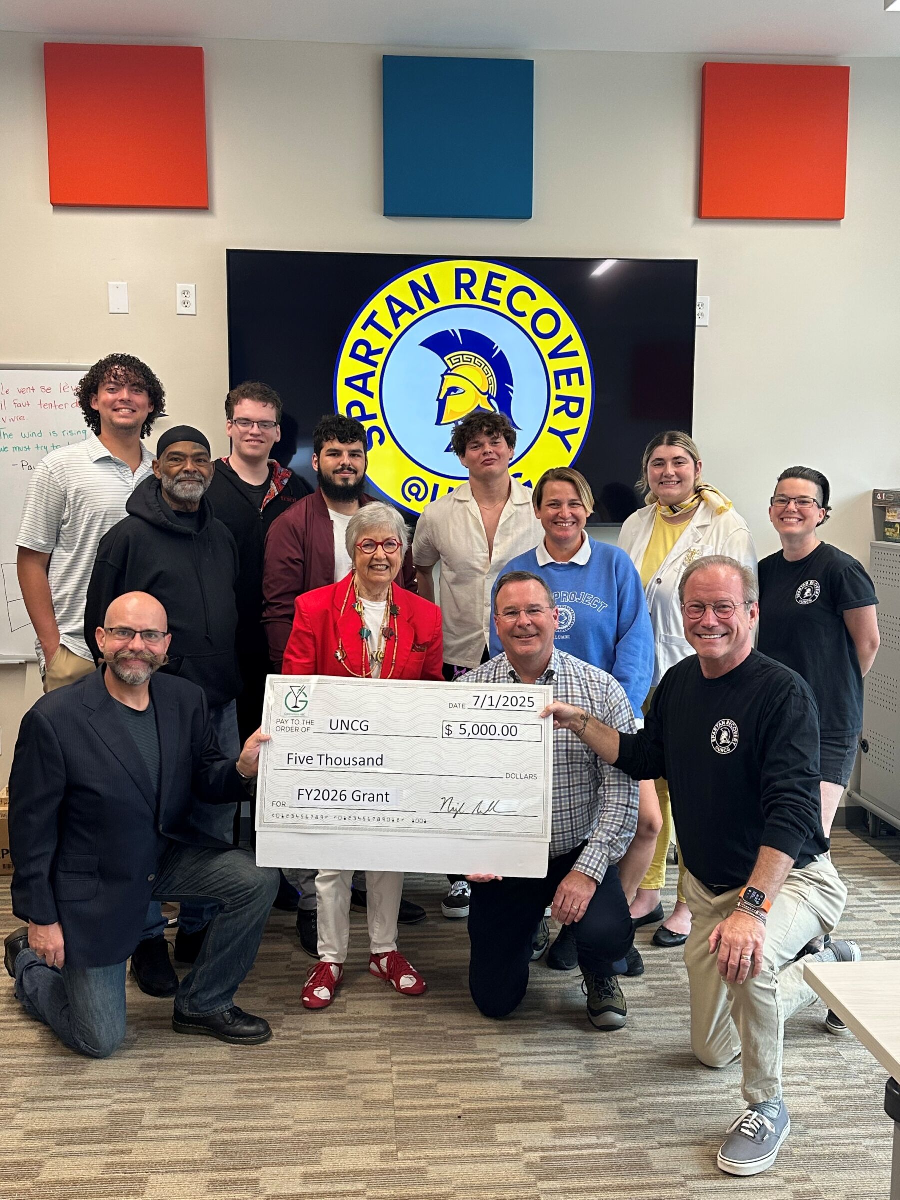 Spartan Recovery at UNCG accepting a grant check from Greensboro ABC for $5,000.